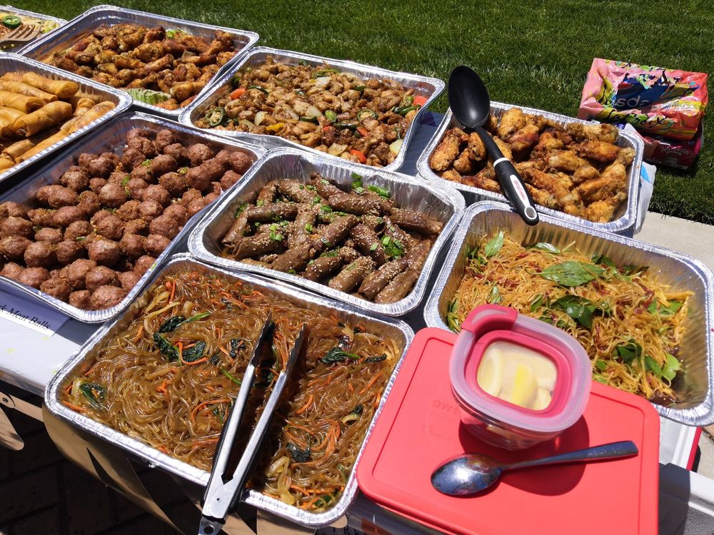 Catering buffet spread with several trays of food