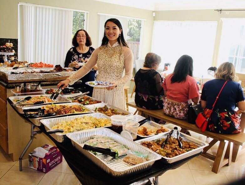Catering buffet spread with several trays of food