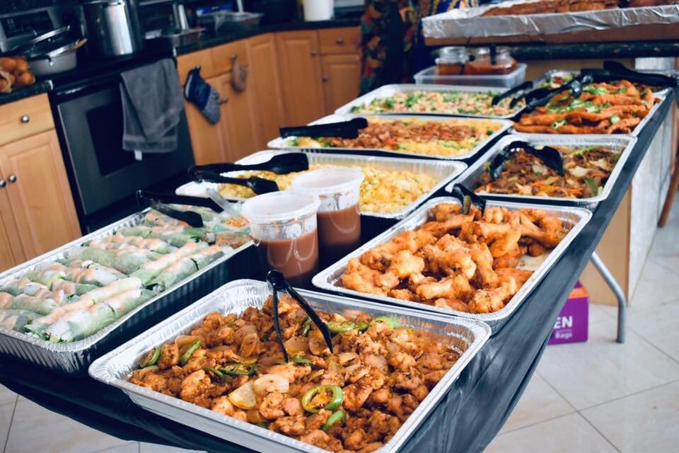 Catering buffet spread with several trays of food
