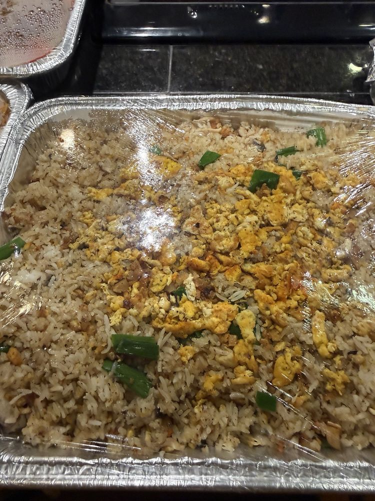 Tray of salted fish fried rice with egg and green onion